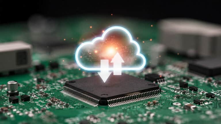 Cloud computing concept visualized above an industrial processor on a printed circuit board for edge-to-cloud data connectivity.
